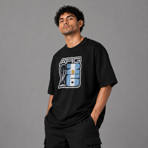 Man wearing a black t-shirt with a logo on a gray background